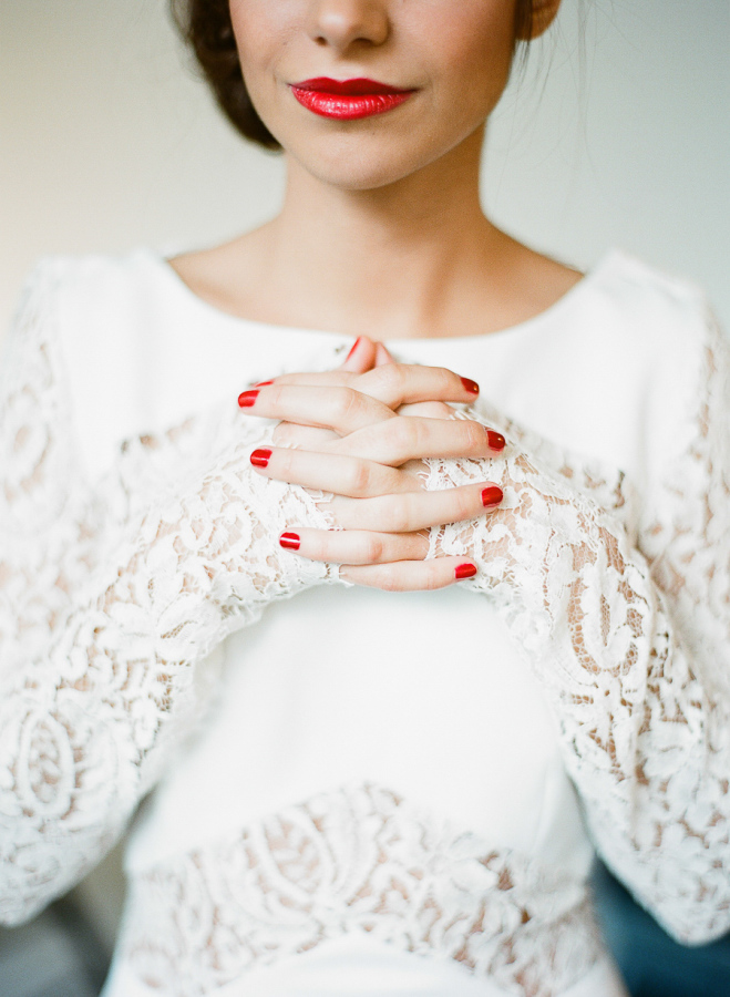 bridebook.co.uk bride in white with red lips and nails