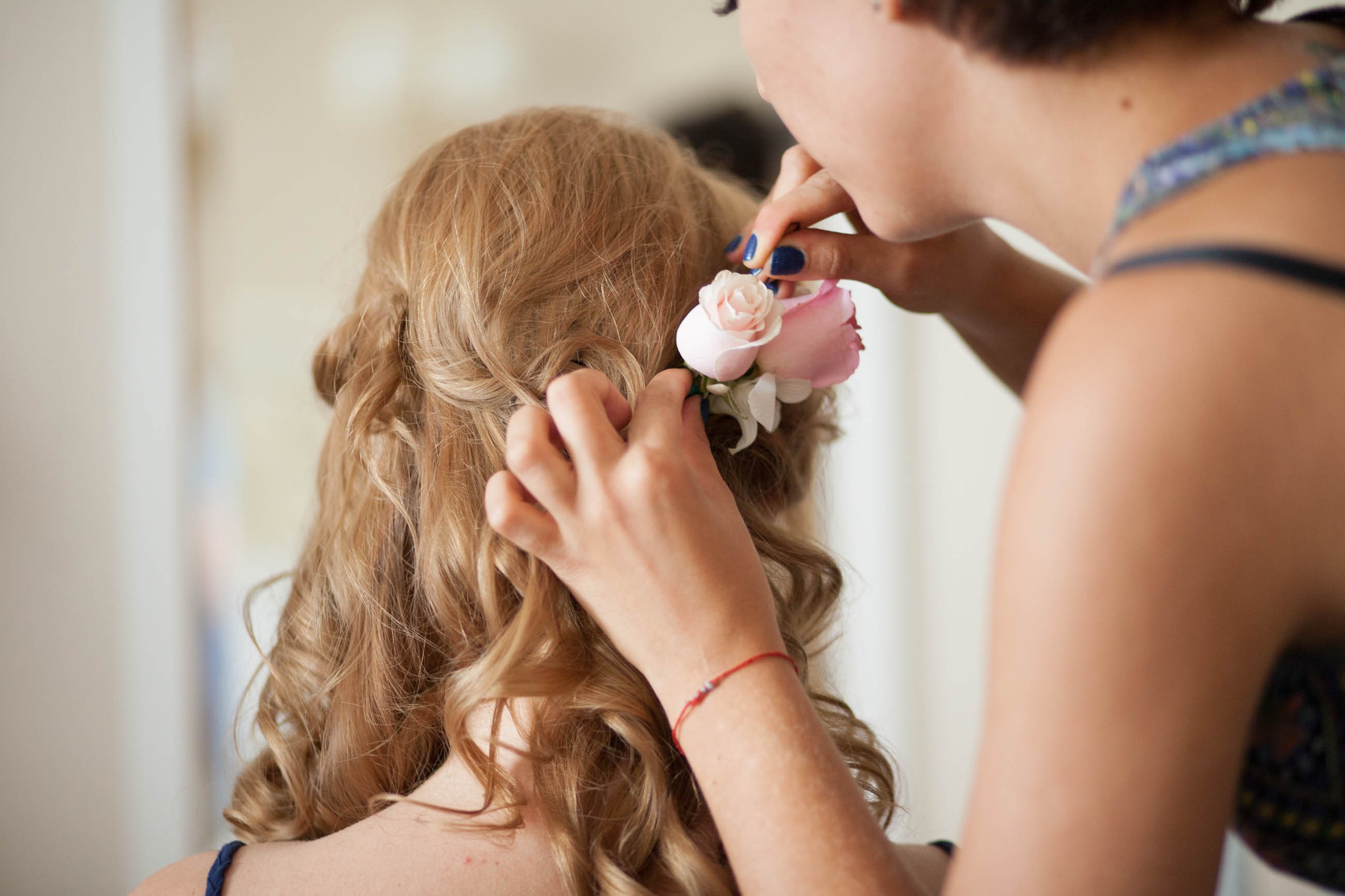 Bridebook.co.uk bride having her hair prepped