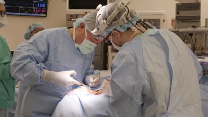 Two-incision approach to sleep surgery implant