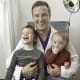 Pediatric neurosurgeon Eric Jackson with his two young patients from Georgia. As a physician scientist, Jackson is also participating in a clinical trial with 41 other centers to further determine best surgical approaches for Chiari malformation.