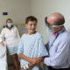 Nick, with his mom and pediatric orthopedic surgeon Paul Sponseller before his spinal fusion surgery.