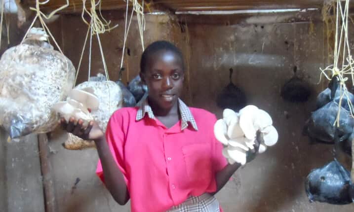 Jolene holding mushrooms