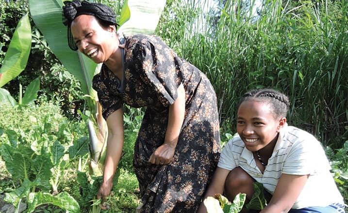 Zenebech works with her daughter in the garden outside their home in Addis Ababa