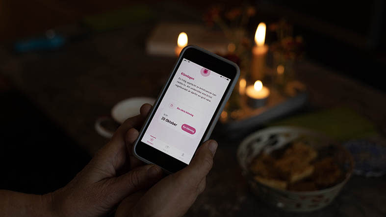 mobiltelefon som visar appen klämdagen