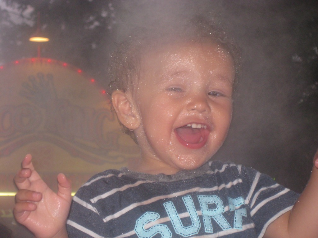 Doused by misters. There was such extreme heat at the fair this year that they installed misters. Lincoln loved them.