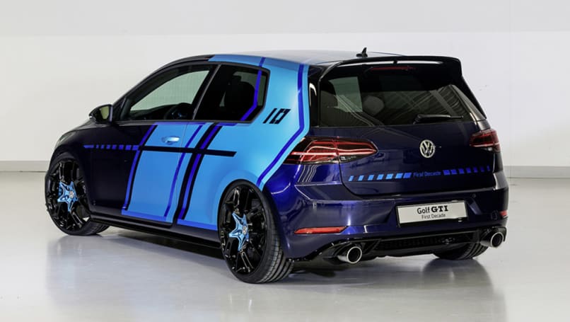 The two-door Golf is painted in Atlantic Blue Metallic and the doors and rear side panels have large areas of foil in the contrasting colour of Satin Ocean Shimmer.