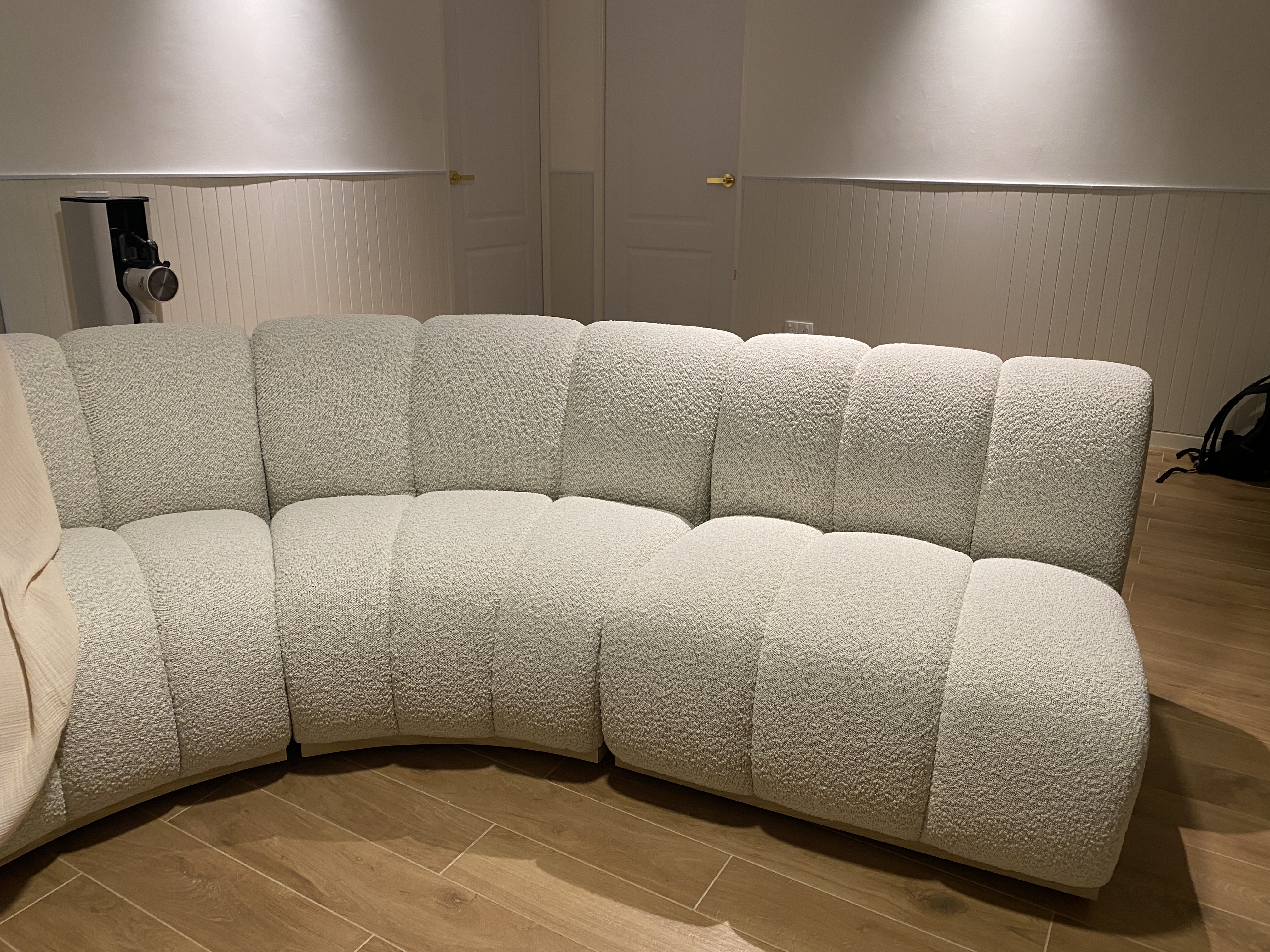 Statement curved sofa with interesting material