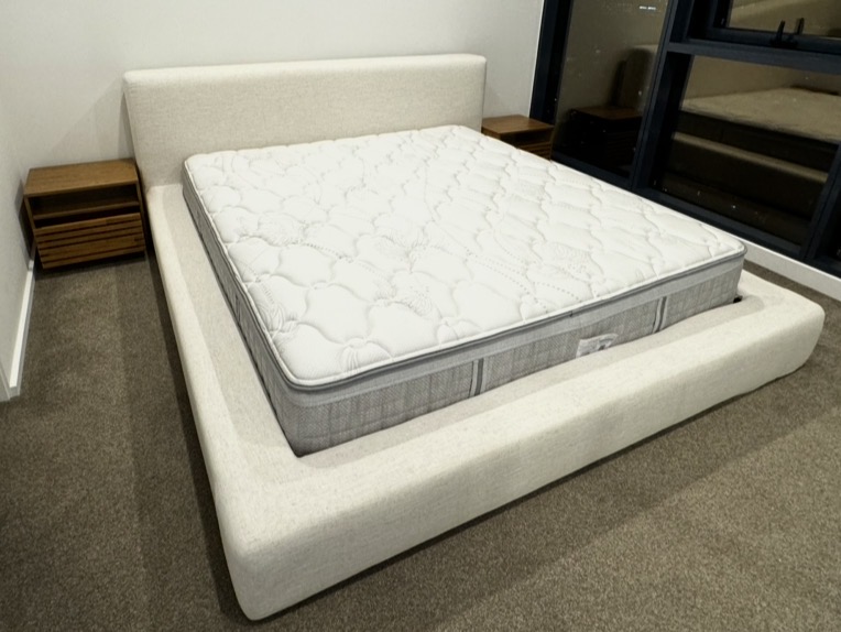 Elevated hotel-style bed