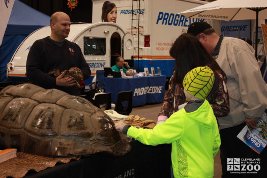 Jim with Snake and kid touching table Tortise- 2014 RV Show