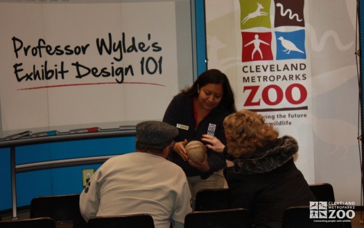 Adults touching Armadillo- 2014 RV Show