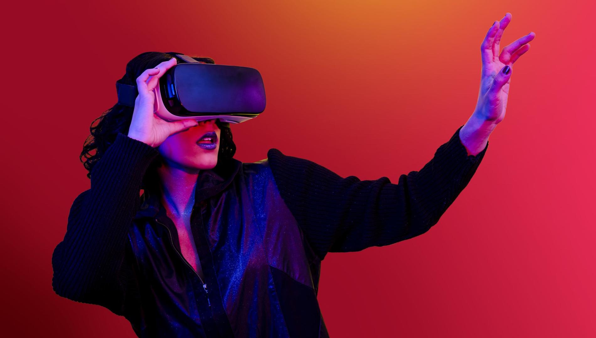 A startled woman recoiling wearing a VR headset