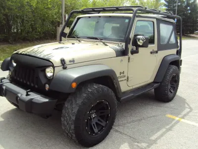 Presenting a 2017 Jeep Wrangler Sport, a robust SUV that combines iconic styling with off-road capability. With 86,537 km on the odometer, this vehicle is well-maintained and ready for adventure. Priced competitively at $21,900 CAD, it offers excellent value for dealers looking to enhance their inventory with a sought-after model.
The Wrangler's reputation for durability and versatility positions it favorably in the market, appealing to a wide range of consumers. Its strong resale potential makes it an attractive option for dealerships aiming to maximize profit margins. This Jeep is a prime opportunity to meet the demand for rugged, reliable vehicles.