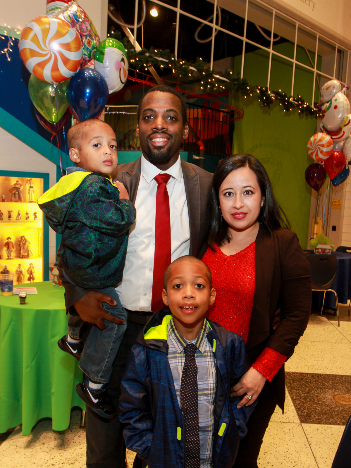 Children's Museum holiday party, Hakim Johnson, Araceli Johnson and children