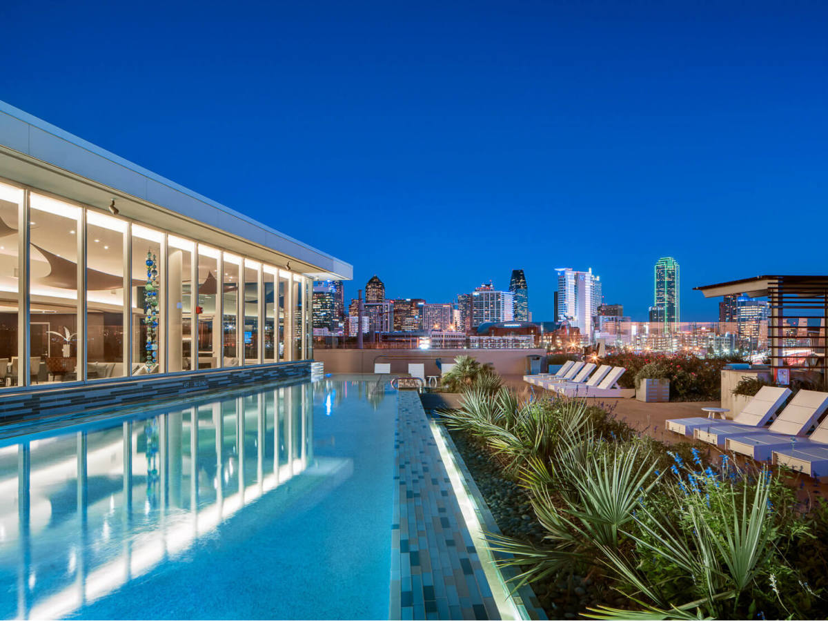 Rooftop pool at dusk at AMLI Design District
