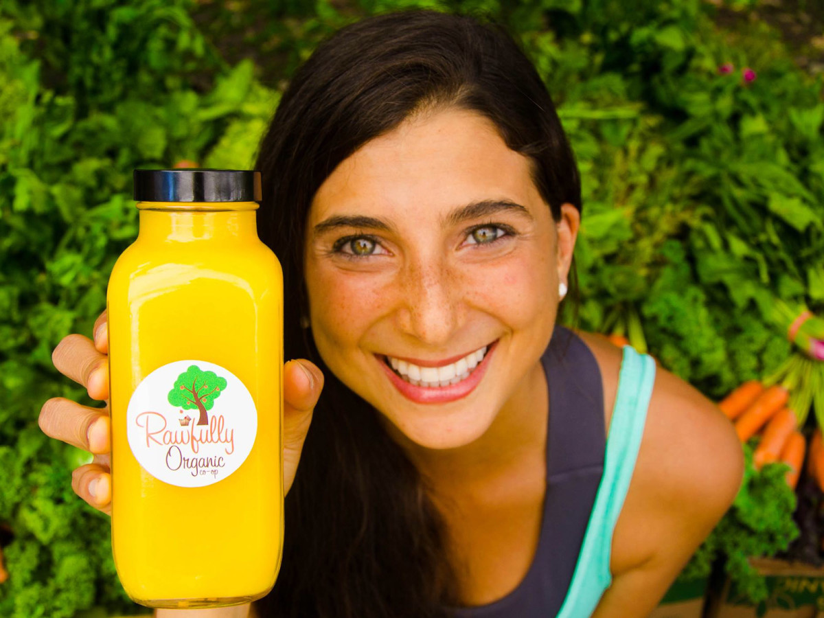Kristina Carrillo-Bucaram is FullyRaw Rawfully Organic Co-op organge juice head shot May 2013