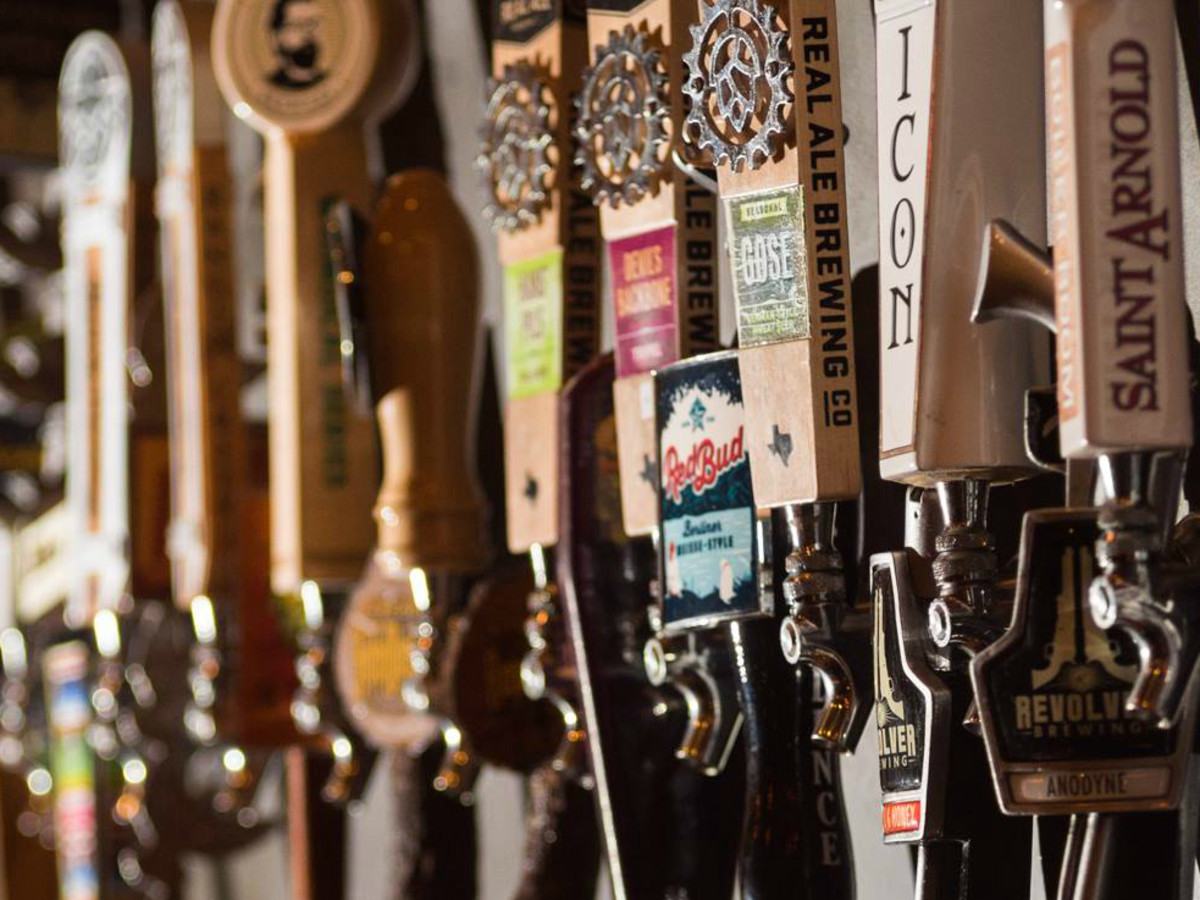Craft Pride Austin bar Rainey Street beer tap wall