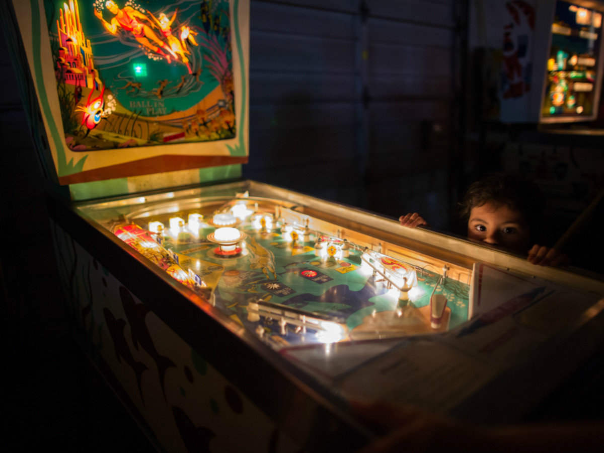 Humans of San Antonio Michael Cirlos photography project kid pinball machine