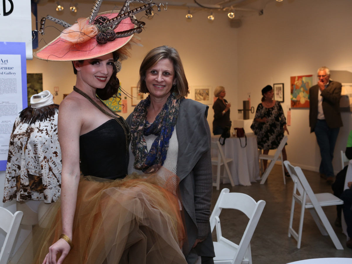 Art on the Avenue Model Stephanie Long shows off Violet Peacock’s design while posing with Dianne Webb