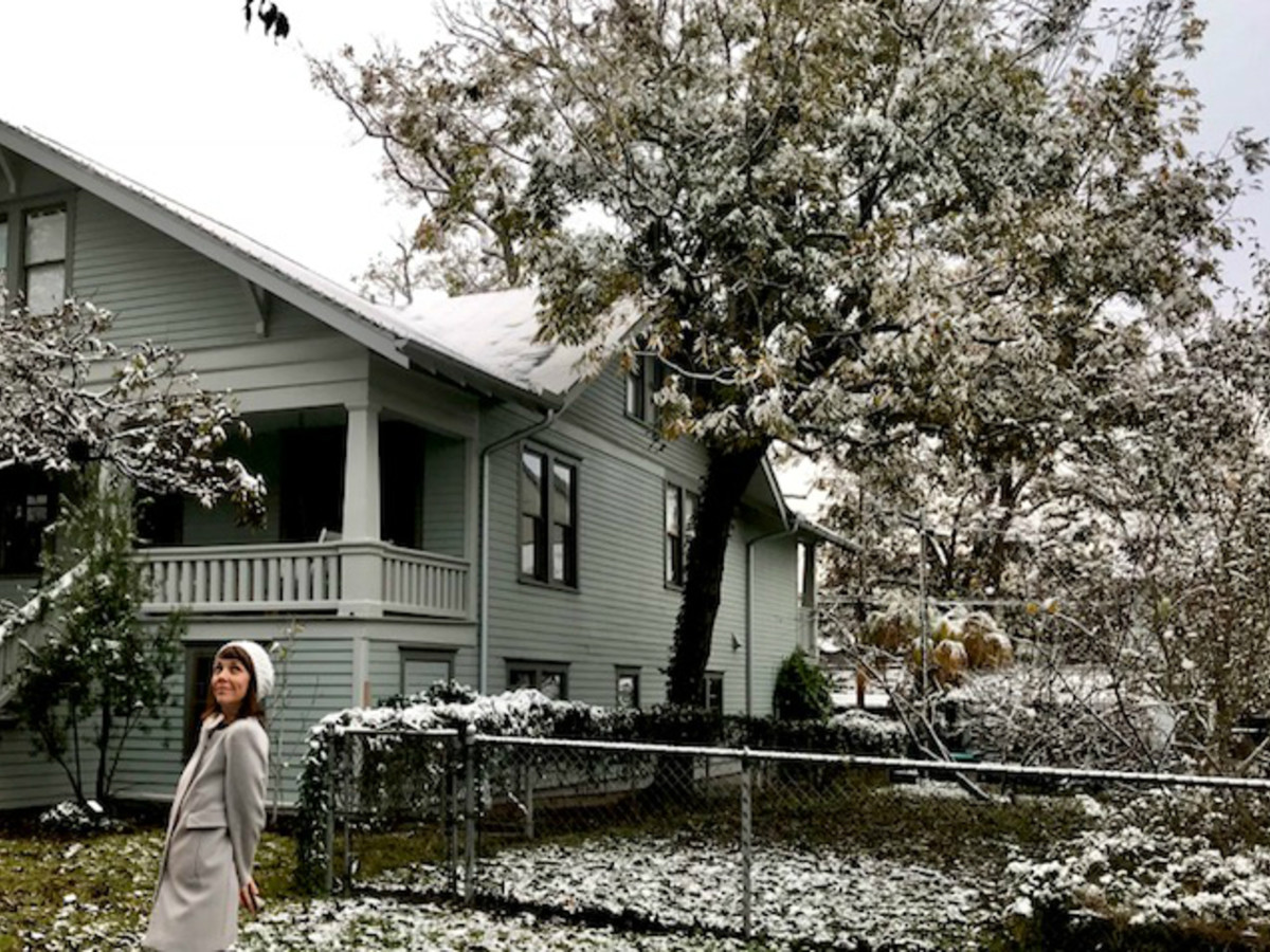 Woman in snowy Heights neighborhood