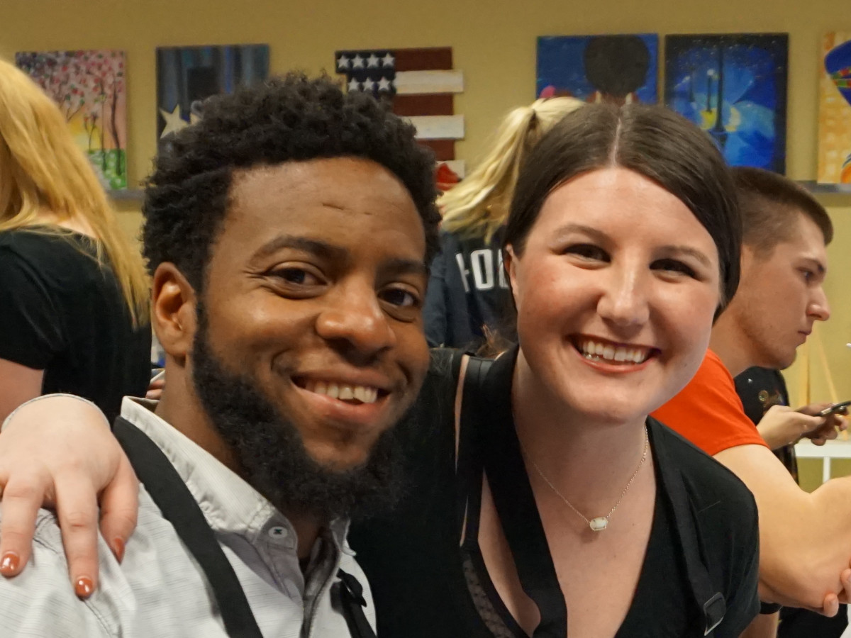 Two people enjoying Painting With a Twist