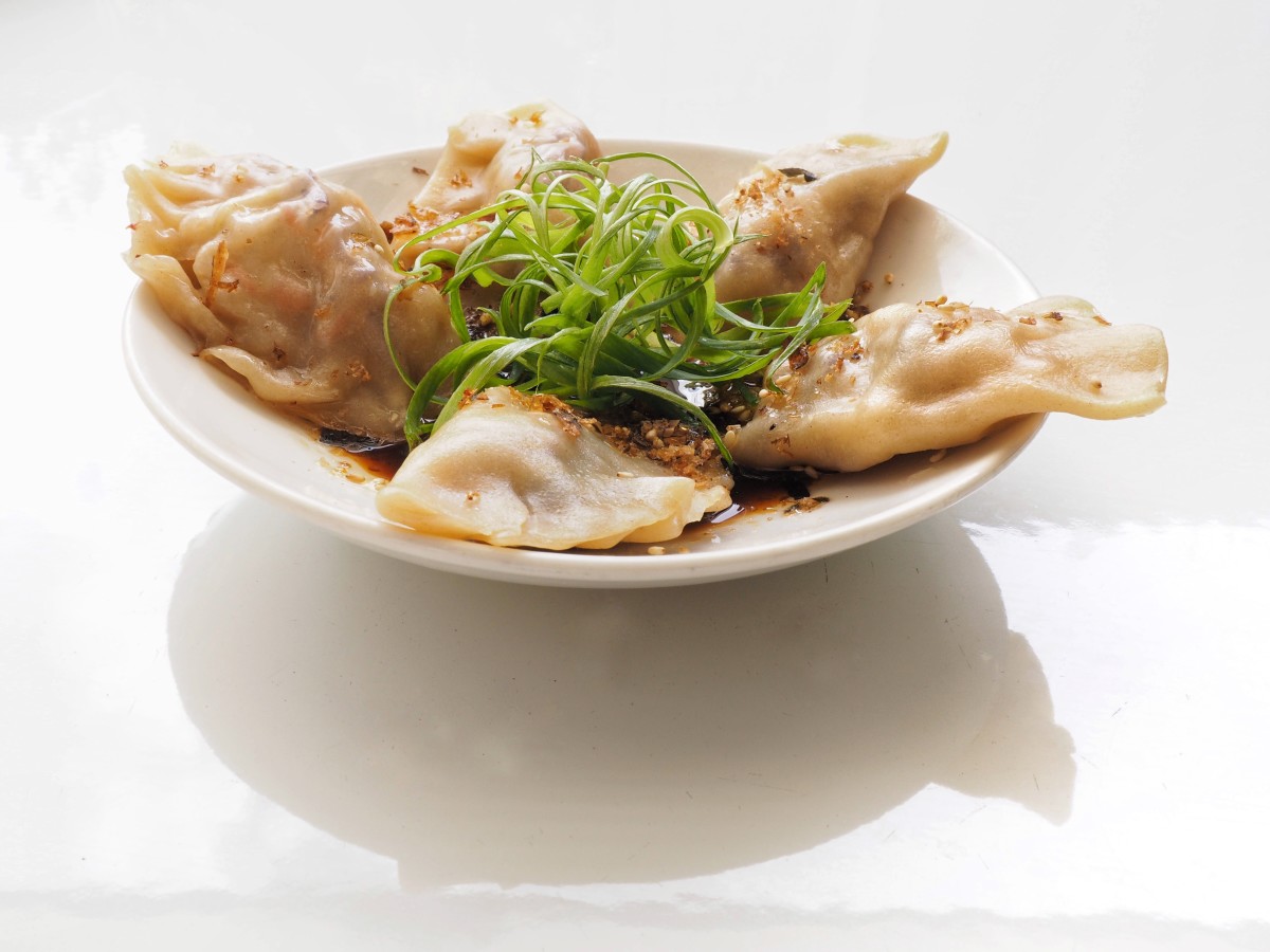 Veggie dumplings with ponzo and chili oil