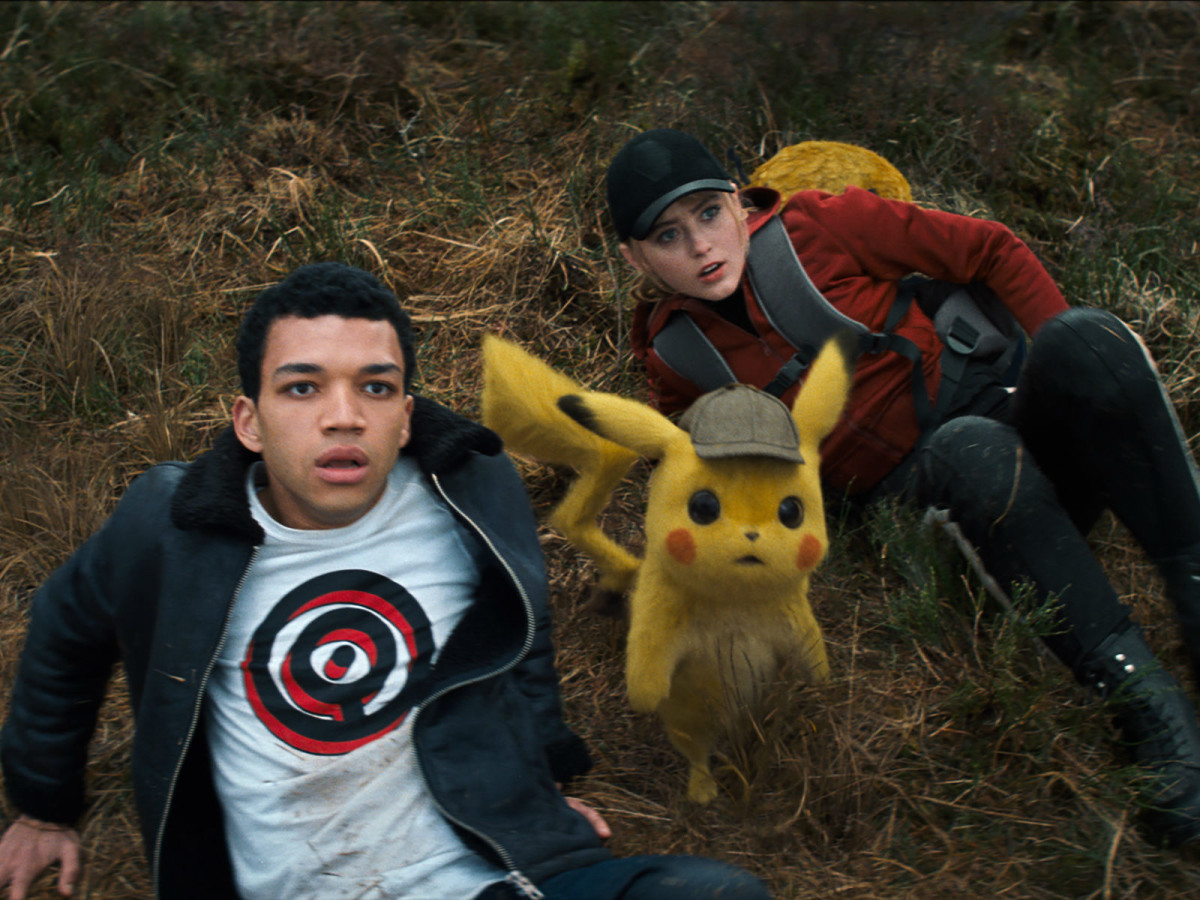Justice Smith, Pikachu (Ryan Reynolds), and Kathryn Newton in Pokémon Detective Pikachu