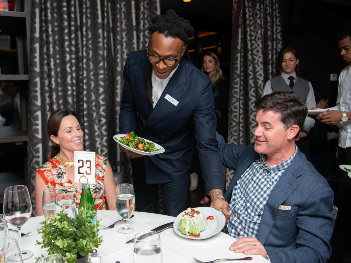 Houston Texans Champions for Youth Dinner DeAndre Hopkins serving