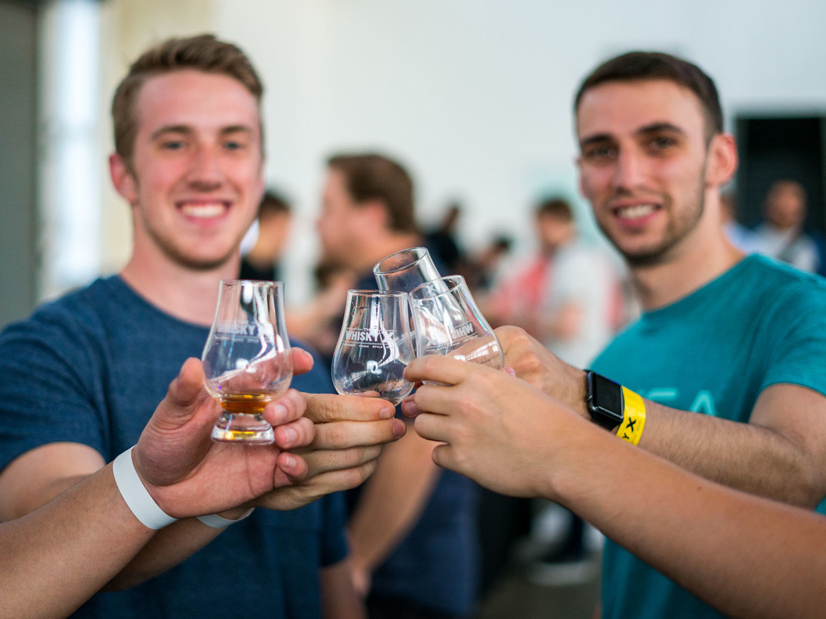 Men toasting with bourbon