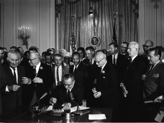 Lyndon B. Johnson LBJ signing Civil Rights Act of 1964 with Martin Luther King Jr. MLK
