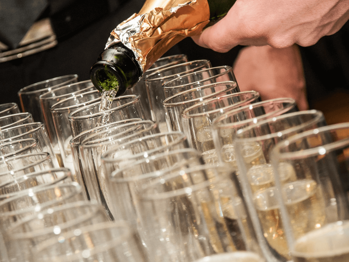 pouring champagne wine into glasses