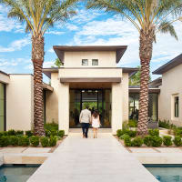 Exterior of home on the AIA Homes Tour with couple out front