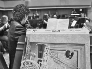 sheet music on music stand in an orchestra