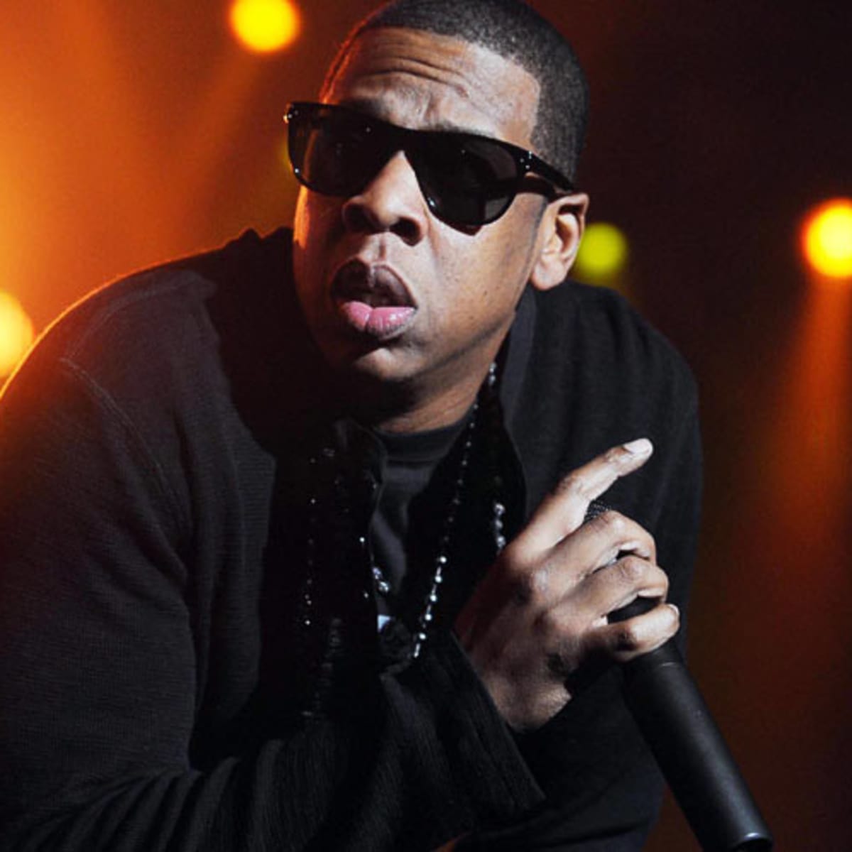 Jay-Z, with mic, sunglasses