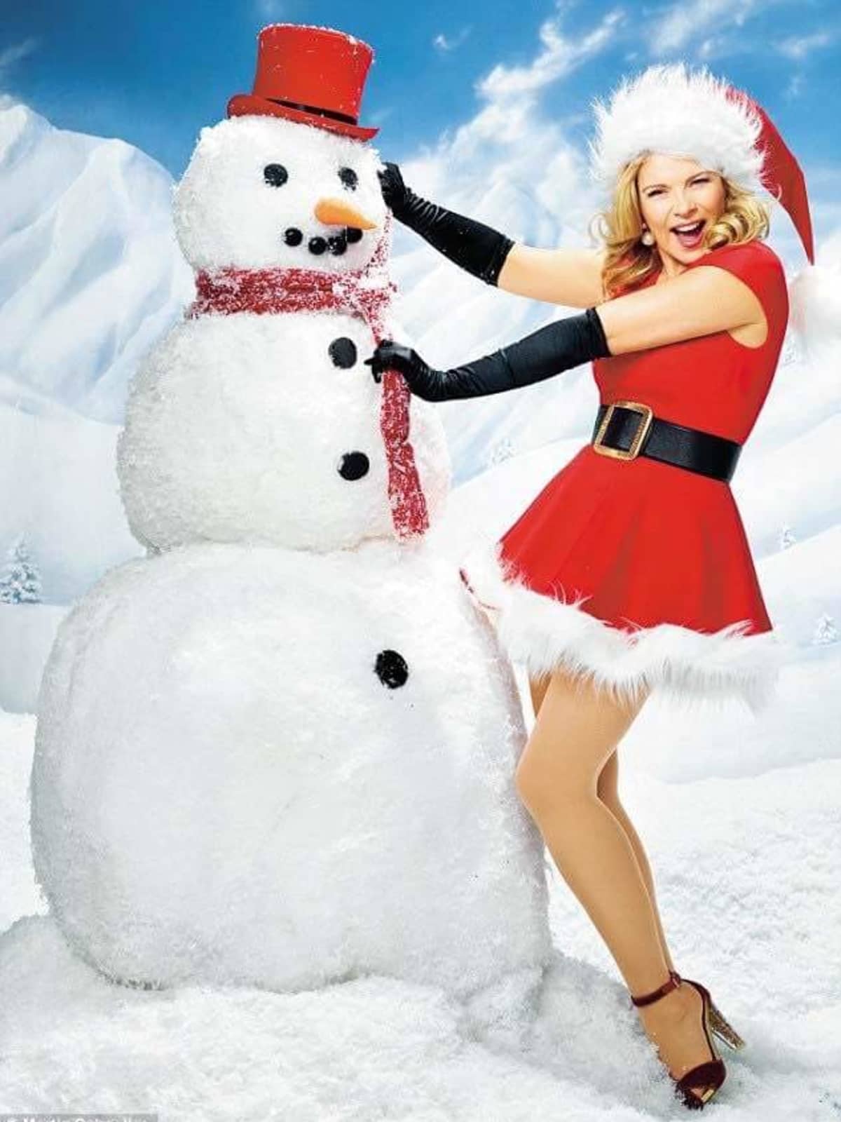 Kim Cattrall As Sexy Santa With Snowman Kim Cattrall As Sexy Santa With Snowman