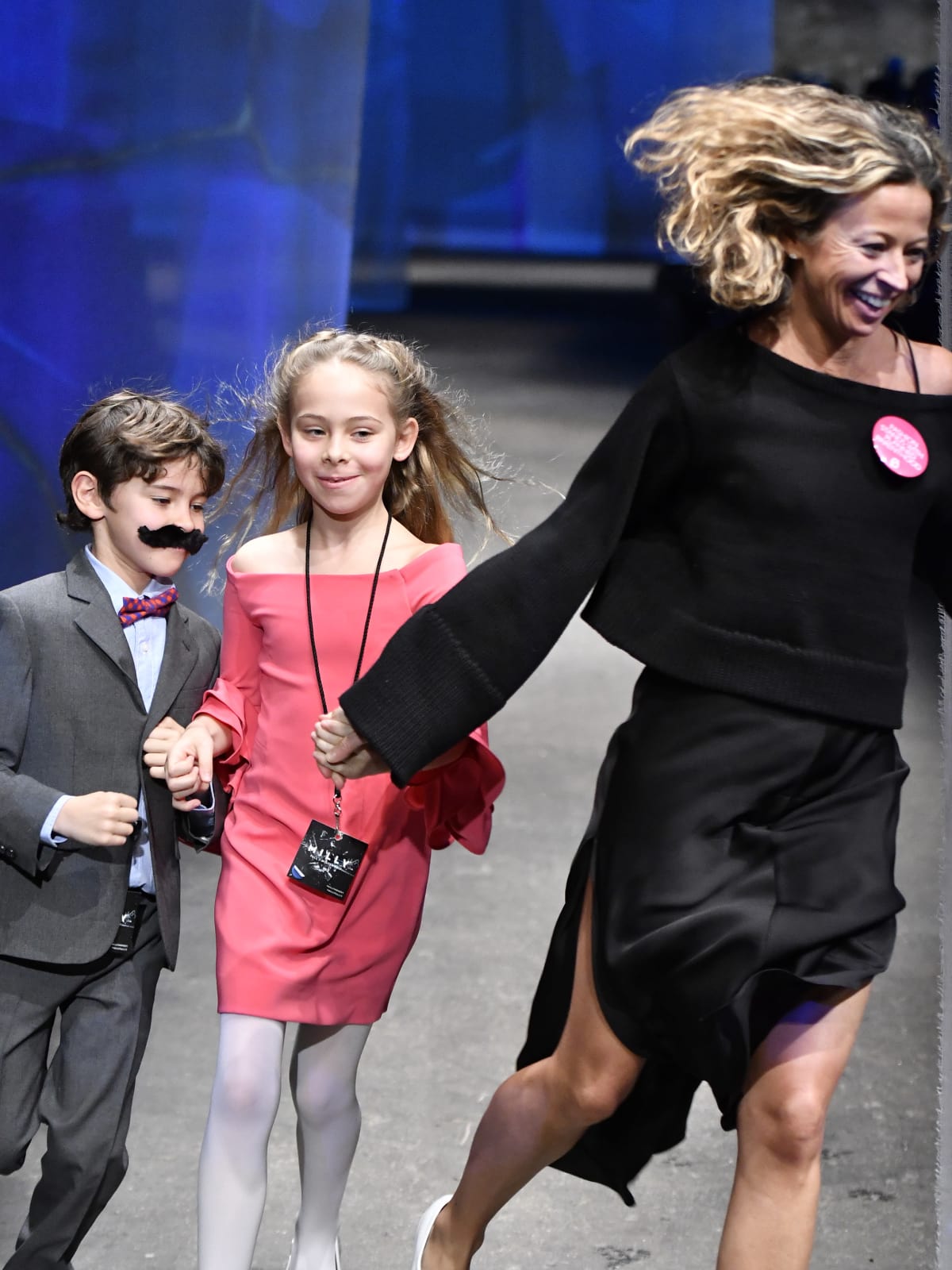 Milly designer Michelle Smith and children at end of fall 2017 runway show