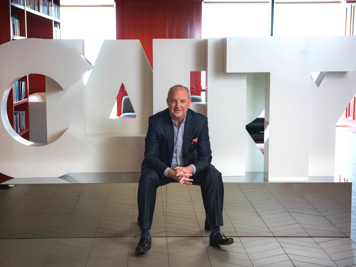 Brad Deutser in front of clarity sign
