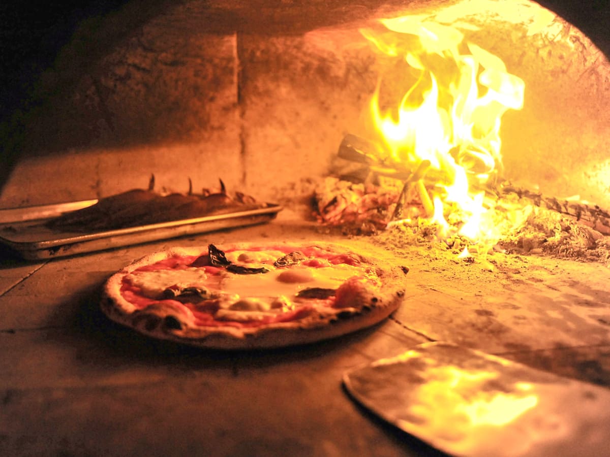 Debora Smail Da Marco Cucina E Vino pizza in pizza oven with fire