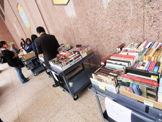 people shopping for books at Texas State Library and Archives Commission fundraiser
