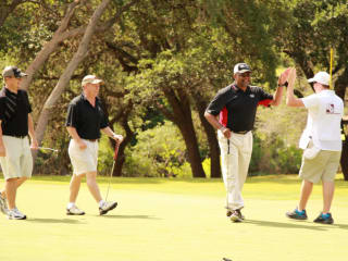 golfers playing in CASA Kids Golf Classic