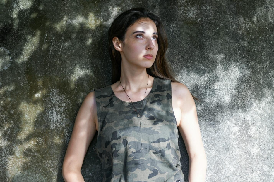 woman in black and grey camouflage tank top