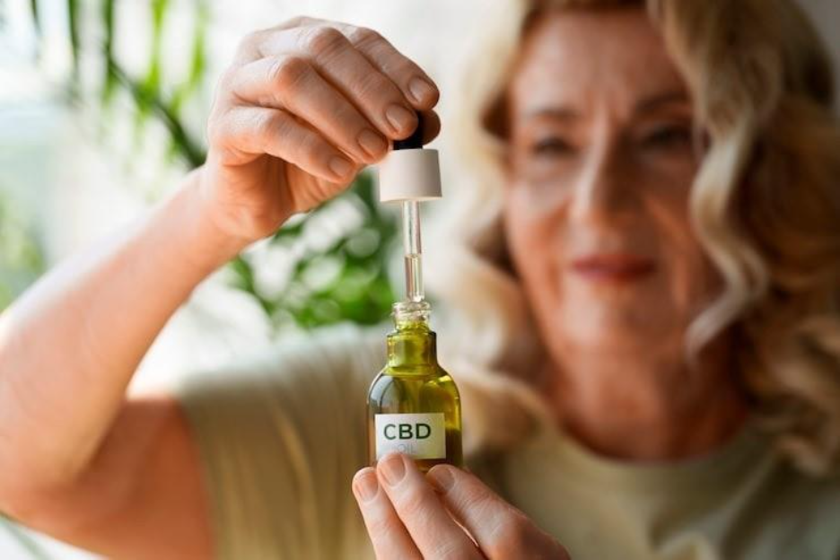 close up on woman using cbd oil