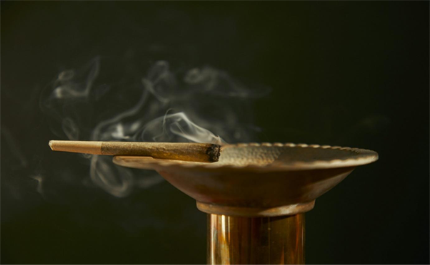 Title: brown wooden stand with white smoke