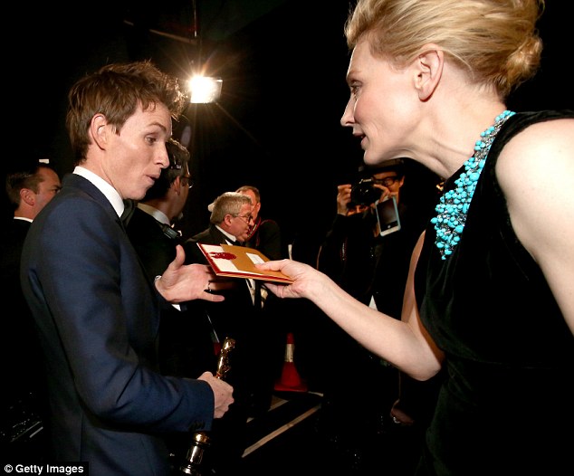 Do you want this? Cate handed the winner the envelope for a keep sake