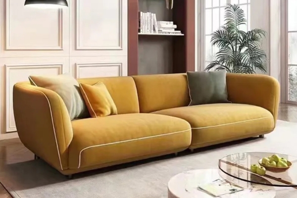 Yellow fabric 4-seater sofa with sleek white lines on the edges, supported by carbon iron feet.