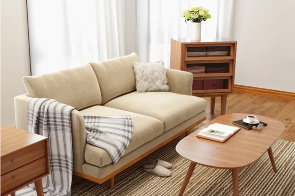 Beige fabric 2-seater sofa with solid-wood legs and armrest.