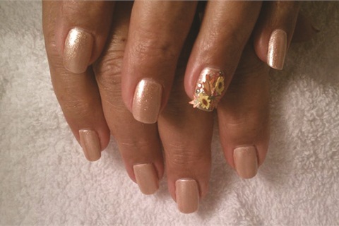 Michelle Aab, technical advisor with Nubar Cosmetics, creates floral nail art for her clients using silk wraps.