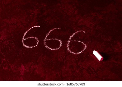 Bloody red 666 written in chalk