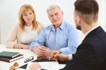 older couple meeting with attorney