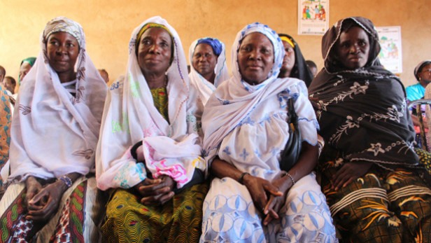 Women in Burkina Faso listen to a discussion on female genital mutilation and cutting, a practice that the U.K. Secretary of State for International Development Justine Greening has pledged to fight. Photo by: Lindsay Mgbor/DfID / CC BY