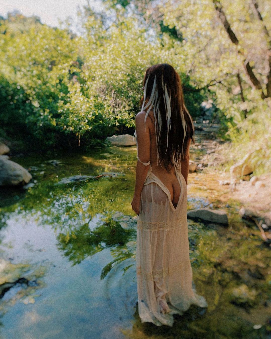 Megan Fox in a sheer, white dress.